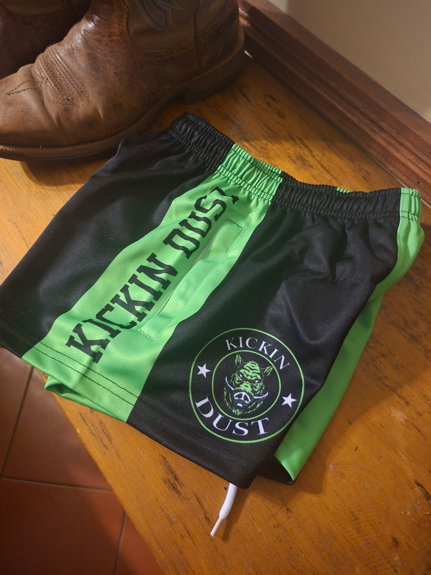 kids kickin dust footy shorts green pig